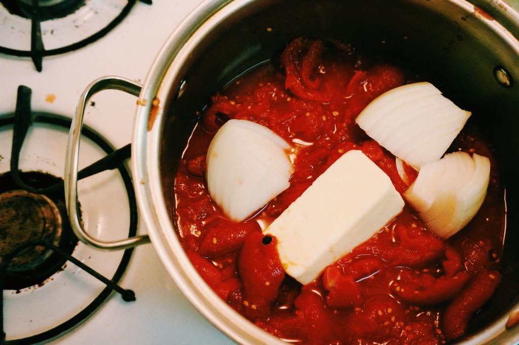 Simmering tomatoes, onion & butter together 
