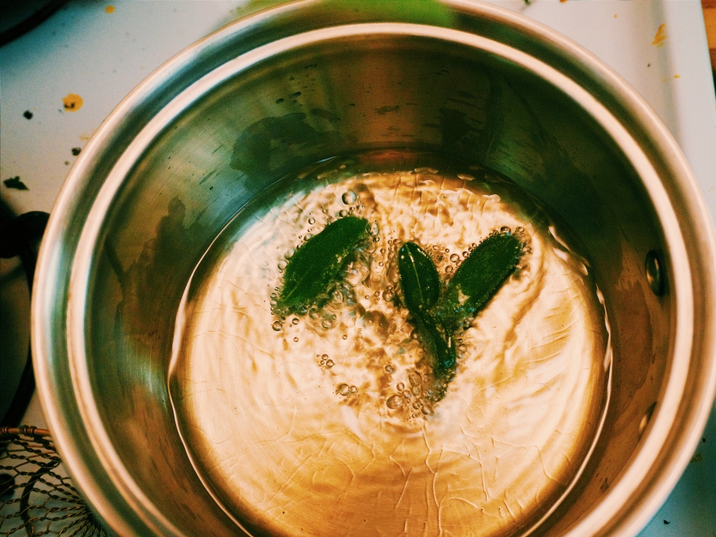 Frying the sage to a bright and crispy green