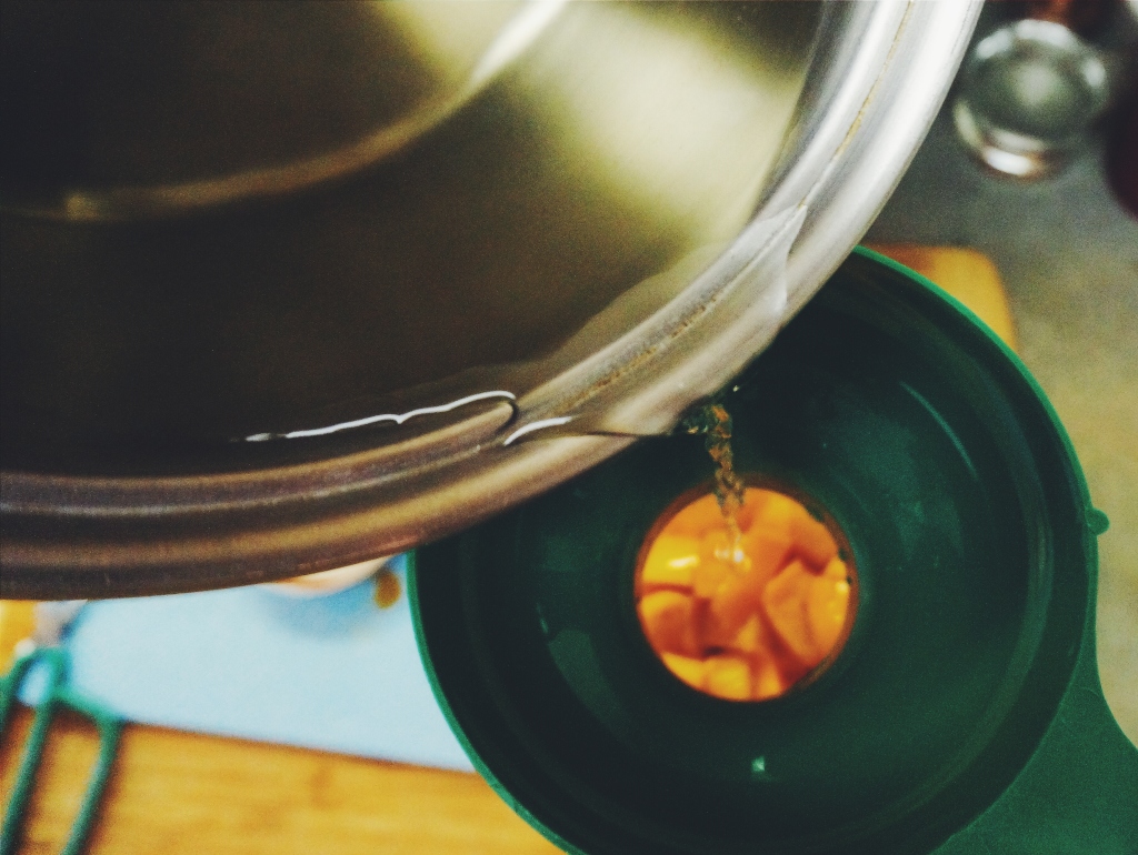 Pouring the hot Vinegar over the Persimmons.  Won't tell you what I went through to get this shot...