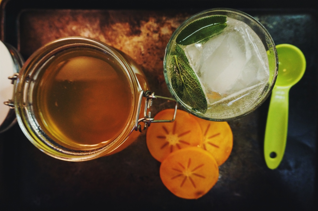 Persimmon Shrub in a homemade soda with fresh muddled sage