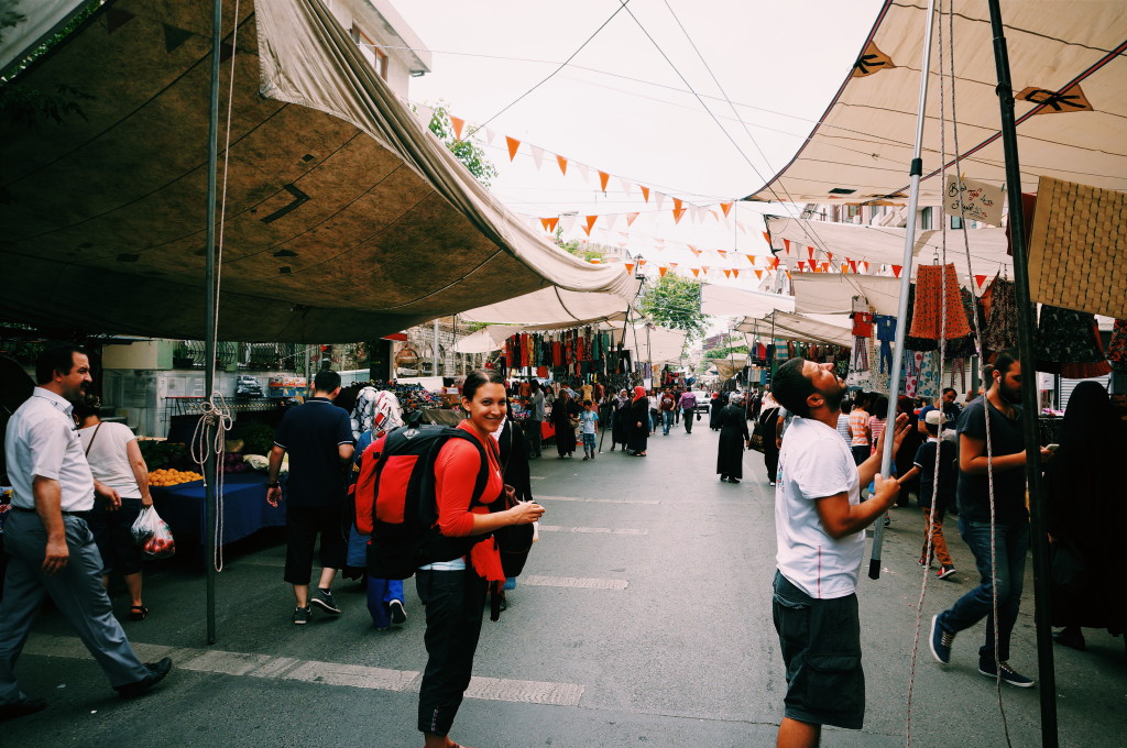 On our way to the airport - couldn't resist a stop at the local street market, backpacks and all