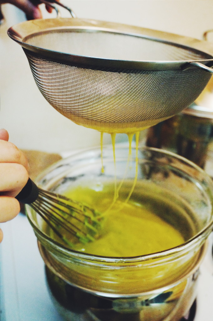 Whisking eggs into curd