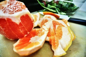 Peel and segment the grapefruit, but save the skeleton to juice